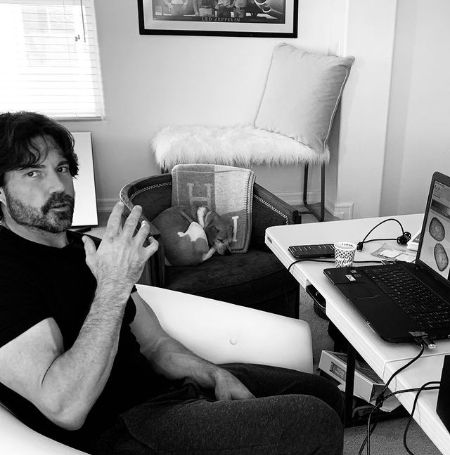 Aaron Phypers working in his home.